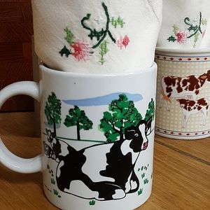 2 cow mugs with 2 cloth embroidered napkins and small wood sign